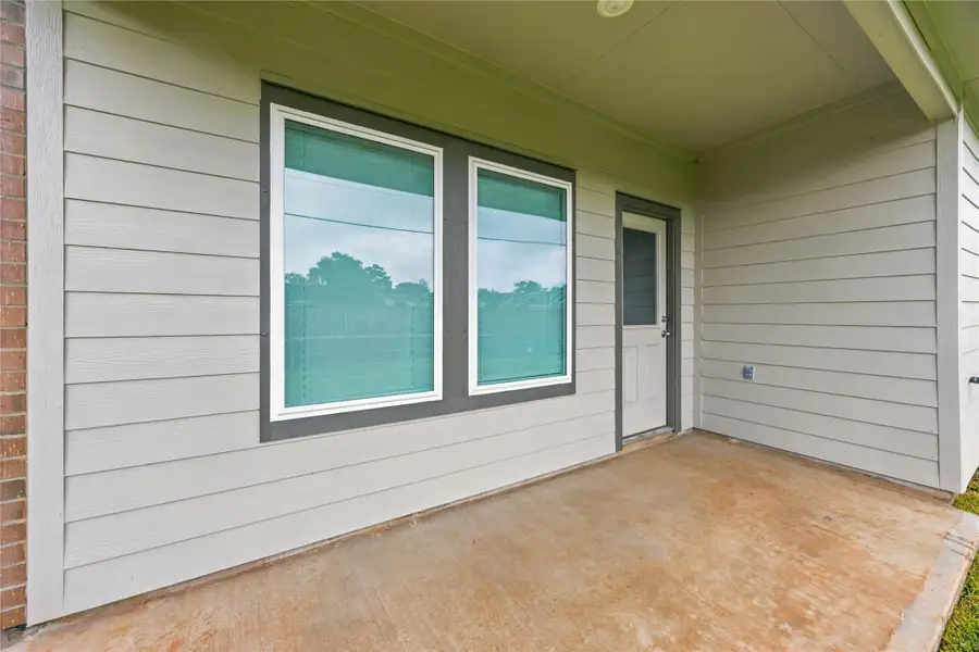 Covered patio — Covered back patio perfect for outdoor seating and relaxation. Covered patio — Covered back patio perfect for outdoor seating and relaxation.