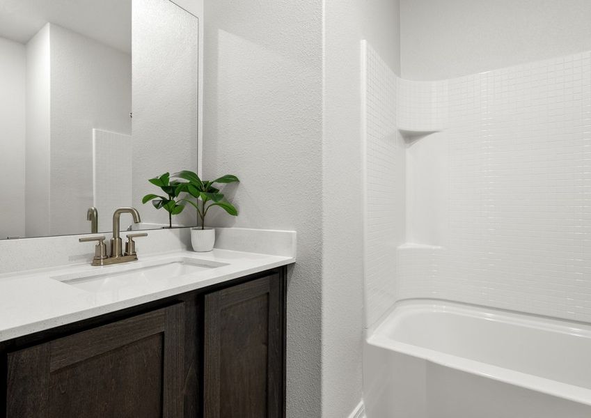 The secondary bathroom has a sprawling vanity. The secondary bathroom has a sprawling vanity.