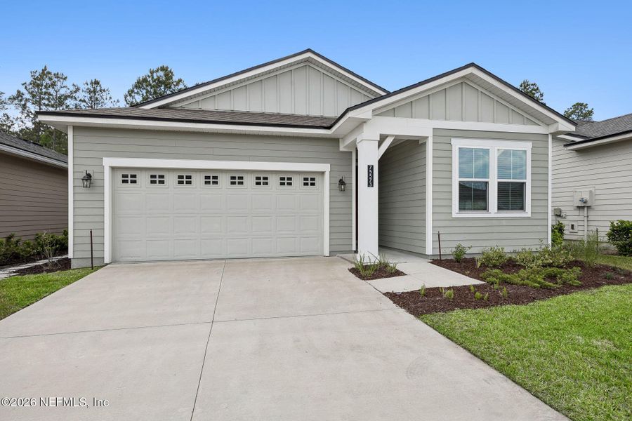 Front exterior of a new home in Tributary, Yulee, FL, highlighting curb appeal (Image 25).