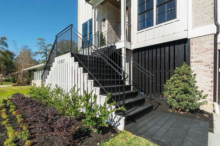 Iron stairway to the front entrance is beautiful.