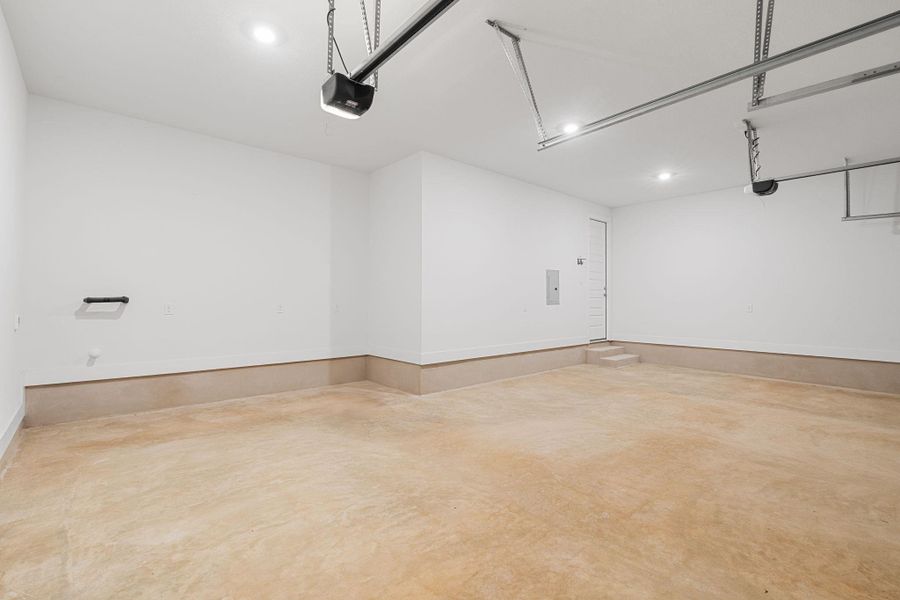 Ample, well-illuminated garage space with easy access to home interior.