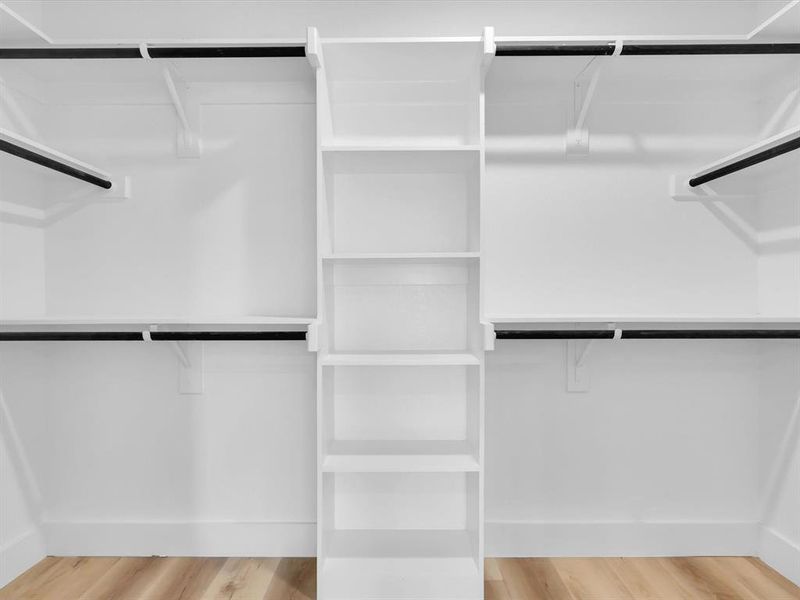 Spacious closet with wood-type flooring