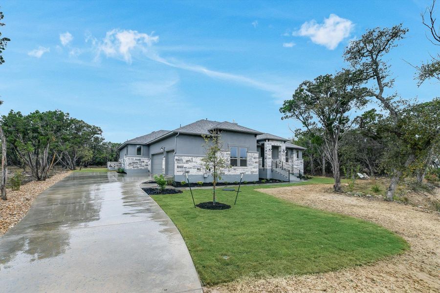 Exterior details and patio area of a home in The Hollows on Lake Travis, Leander (Image 3).