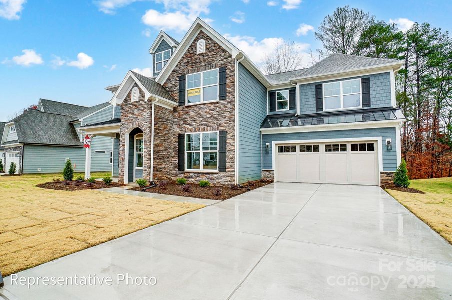 Front exterior of a new home in Harmony, Harrisburg, NC, highlighting curb appeal (Image 2). Front exterior of a new home in Harmony, Harrisburg, NC, highlighting curb appeal (Image 2).