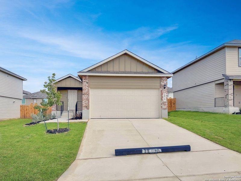 Front exterior of a new home in Stonehill, San Antonio, TX, highlighting curb appeal (Image 2). Front exterior of a new home in Stonehill, San Antonio, TX, highlighting curb appeal (Image 2).