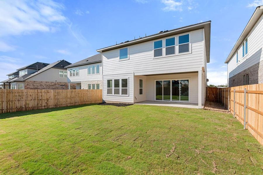 Exterior details and patio area of a home in Heritage, Dripping Springs (Image 22).