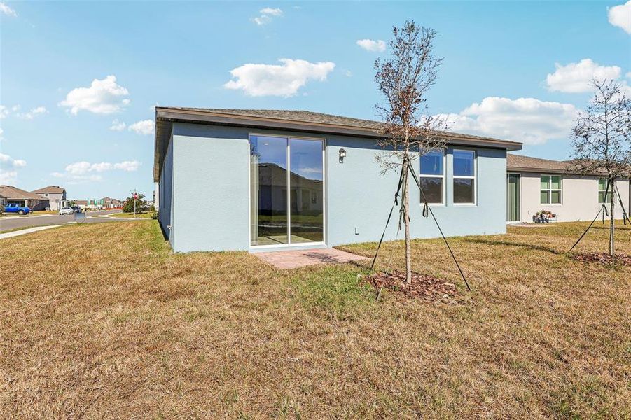 Exterior details and patio area of a home in Lake Deer Estates - Classic Series, Poinciana (Image 21).