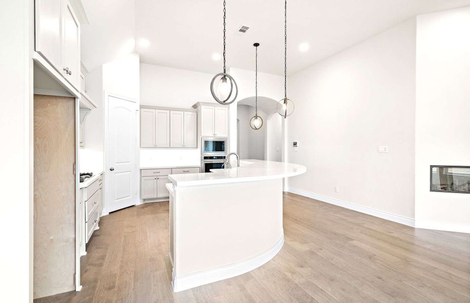 Representative furnished interior of a home built from the 2406 by Ravenna Homes in The Highlands 55′, Porter (Image 8).