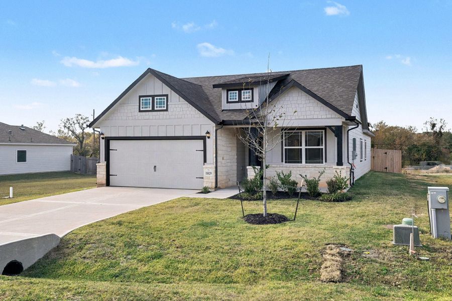 Front exterior of a new home in Clear View Estates, Willis, TX, highlighting curb appeal (Image 2). Front exterior of a new home in Clear View Estates, Willis, TX, highlighting curb appeal (Image 2).