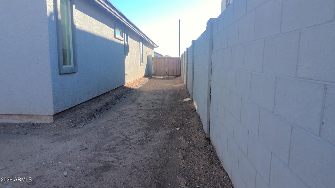 Wide side yard with double gate