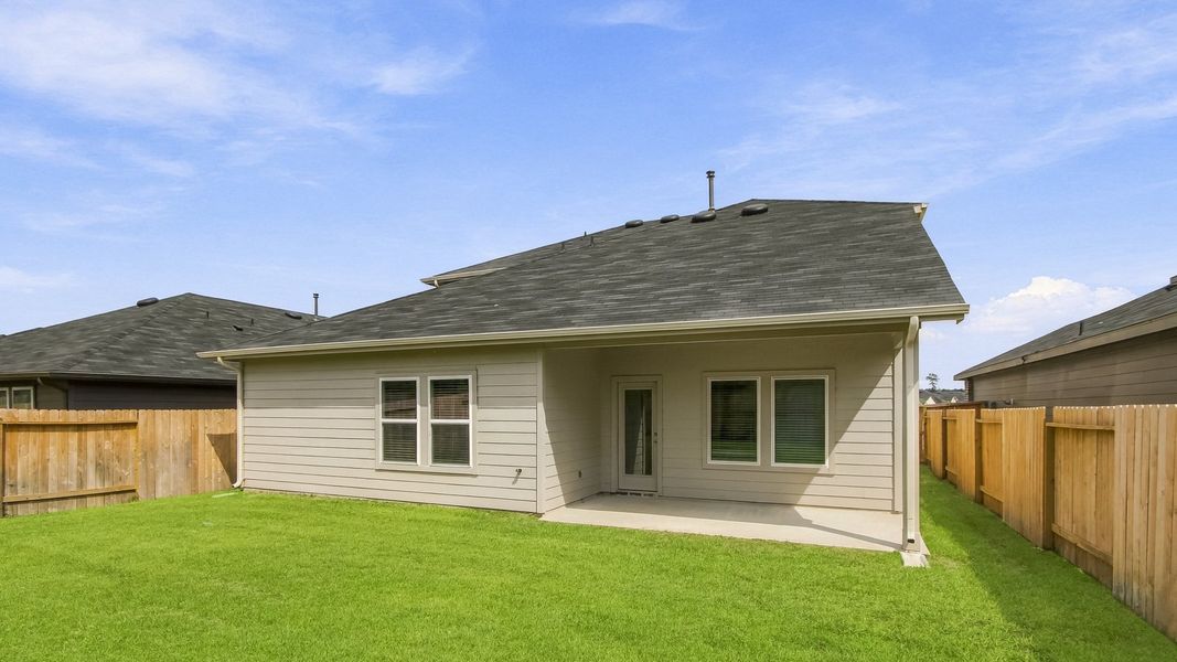 Exterior details and patio area of a home in Harrington Trails at The Canopies, Splendora (Image 3).