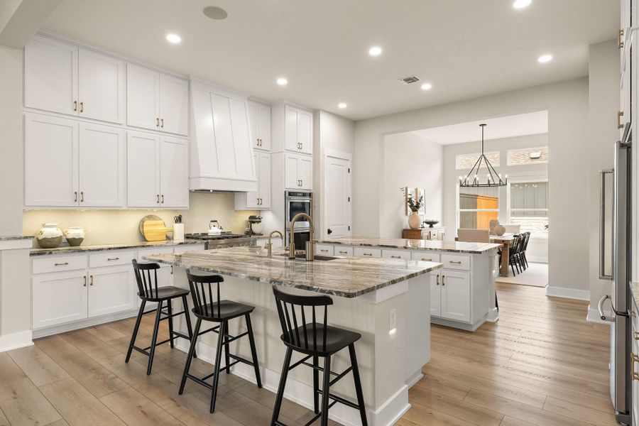 Chef-inspired kitchen with extensive cabinetry and premium finishes.