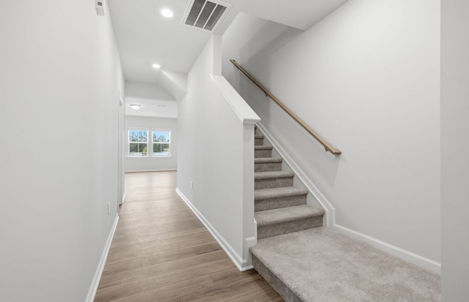 Spacious, unfurnished interior of a new home in Saunders Farm, Willow Spring (Image 16).