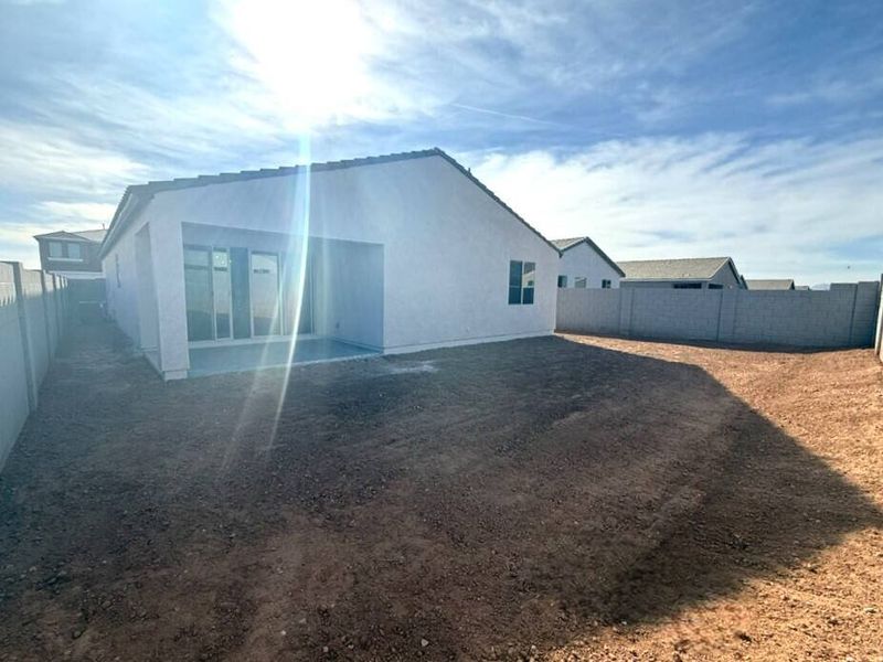 Covered patio and large backyard