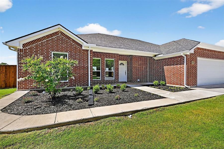 Front exterior of a new home in , Ector, TX, highlighting curb appeal (Image 24). Front exterior of a new home in , Ector, TX, highlighting curb appeal (Image 24).