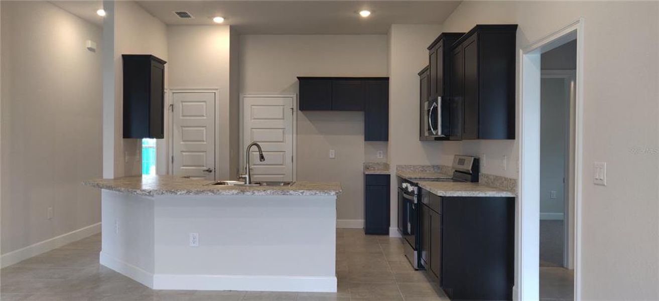 Furnished interior view inside a new home in Sunset Landing, Spring Hill (Image 5).