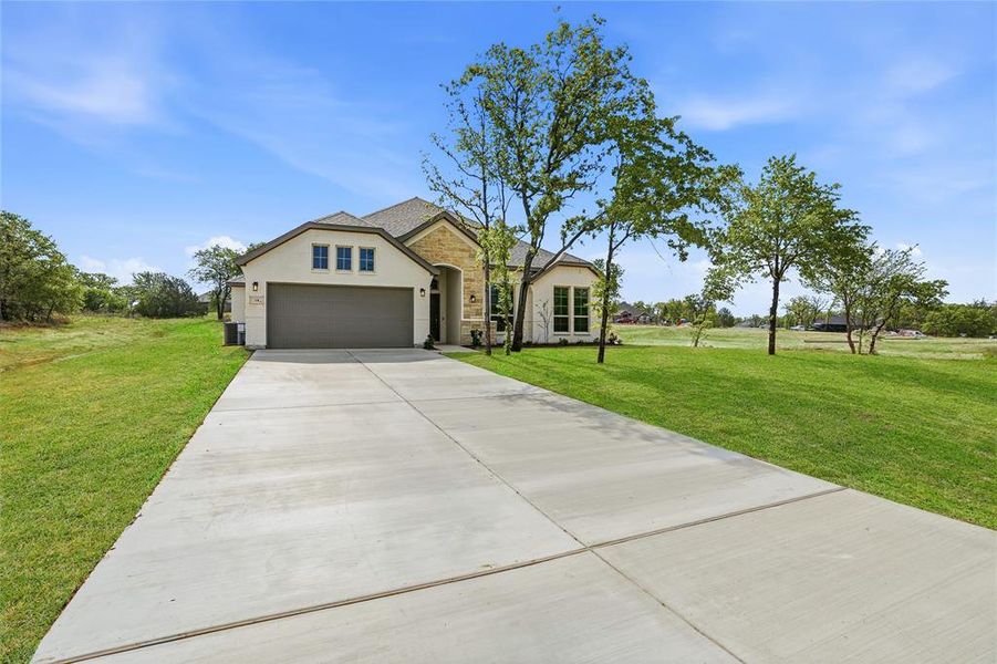 Front exterior of a new home in Arbor Oaks, Boyd, TX, highlighting curb appeal (Image 25).