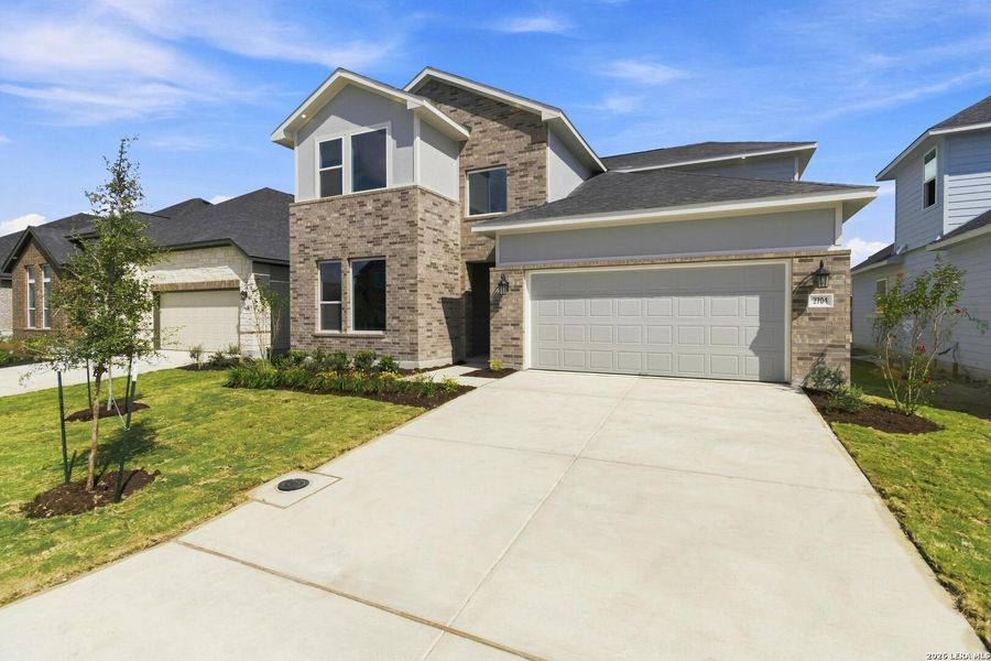 Front exterior of a new home in Cordova Crossing, Seguin, TX, highlighting curb appeal (Image 2). Front exterior of a new home in Cordova Crossing, Seguin, TX, highlighting curb appeal (Image 2).