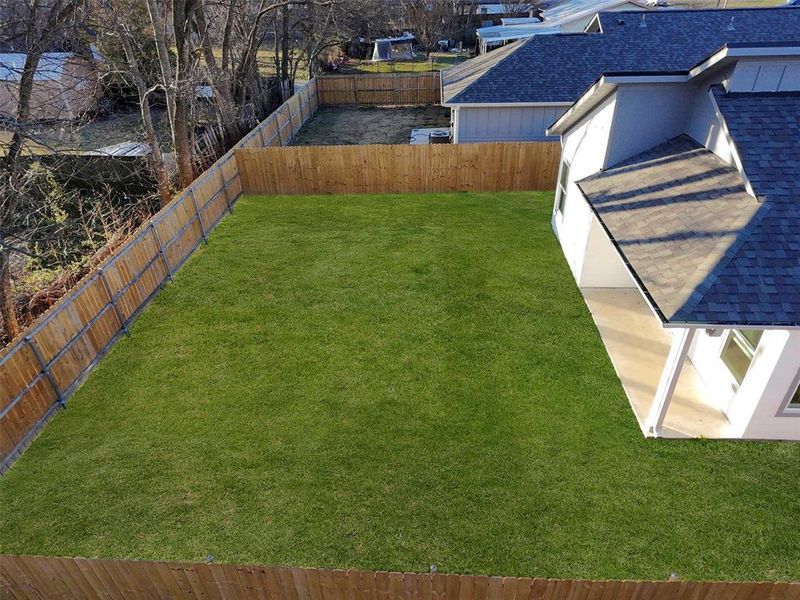 View of fenced backyard