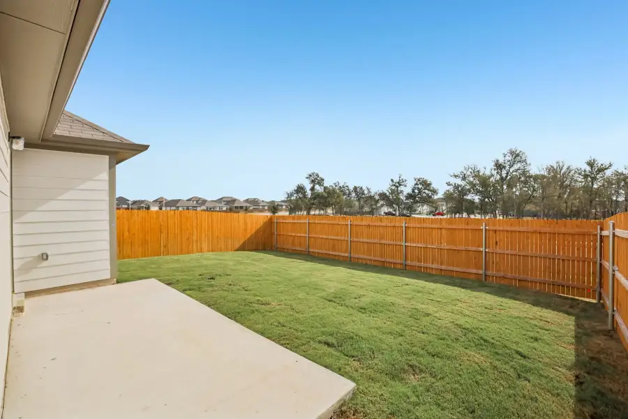 Exterior details and patio area of a home in Trinity Ranch, Elgin (Image 4).