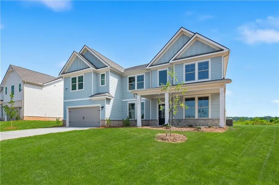 Front exterior of a new home in Brighton, Locust Grove, GA, highlighting curb appeal (Image 2). Front exterior of a new home in Brighton, Locust Grove, GA, highlighting curb appeal (Image 2).