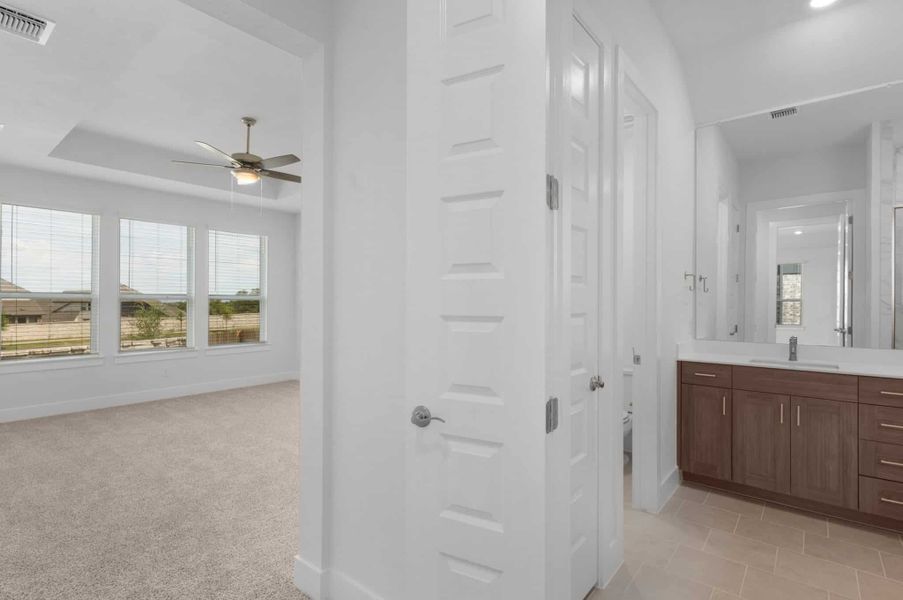 Furnished interior view inside a new home in University Heights, Round Rock (Image 11).