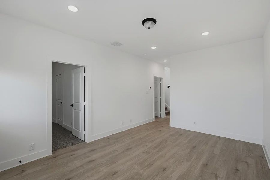 Representative unfurnished interior of a home built from the Athena by Chesmar Homes in Prominence Urban, San Antonio (Image 37).