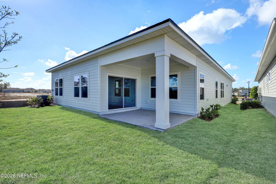 Exterior details and patio area of a home in New 55+ Active Adult Community in Palm Coast, Florida, Palm Coast (Image 3).