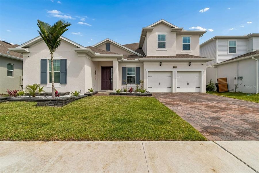 Front exterior of a new home in , Orlando, FL, highlighting curb appeal (Image 31).