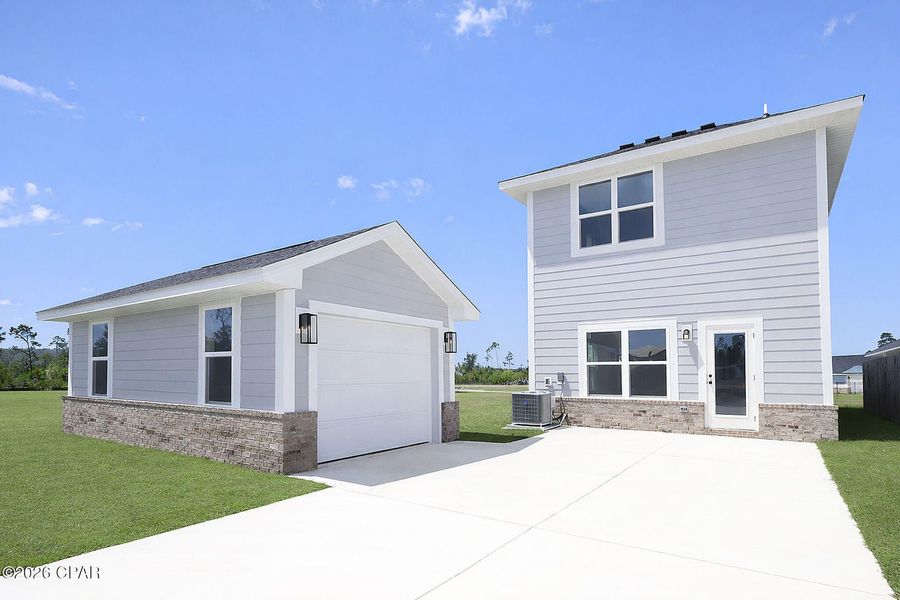 Front exterior of a new home in East Bay, Panama City, FL, highlighting curb appeal (Image 15).