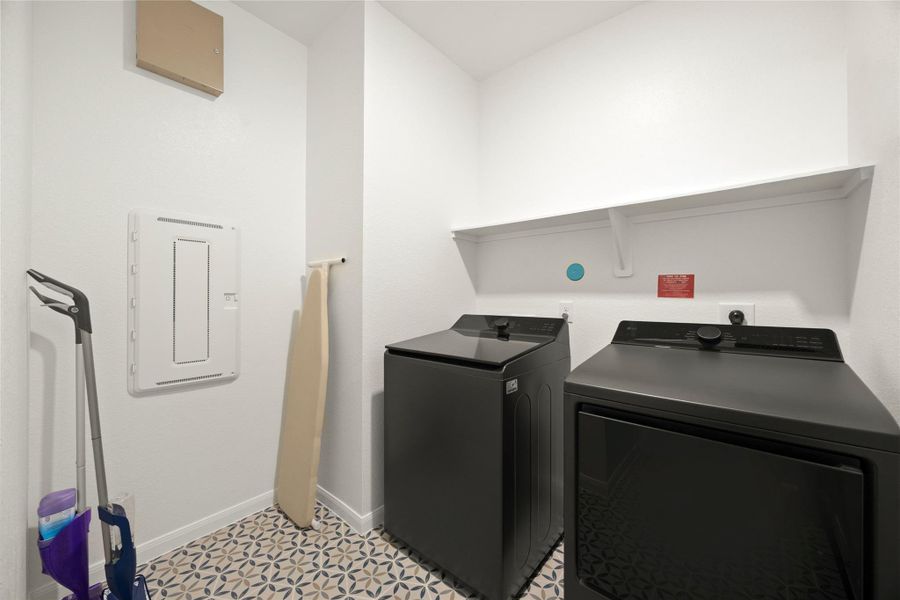 The laundry room is conveniently located just off the garage entrance. The laundry room is conveniently located just off the garage entrance.