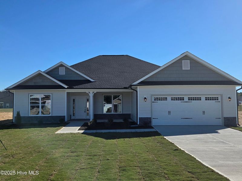 Front exterior of a new home in Magnolia Estates, Battleboro, NC, highlighting curb appeal (Image 1). Front exterior of a new home in Magnolia Estates, Battleboro, NC, highlighting curb appeal (Image 1).