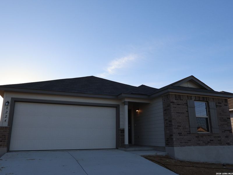Front exterior of a new home in Agave, San Antonio, TX, highlighting curb appeal (Image 23).