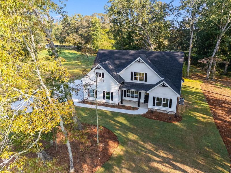 Front exterior of a new home in LOVVORN ESTATES, Carrollton, GA, highlighting curb appeal (Image 23).