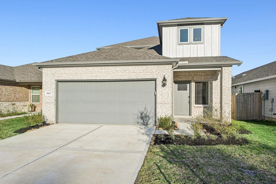 Front exterior of a new home in Landing Meadows - Traditional Series, New Caney, TX, highlighting curb appeal (Image 2). Front exterior of a new home in Landing Meadows - Traditional Series, New Caney, TX, highlighting curb appeal (Image 2).