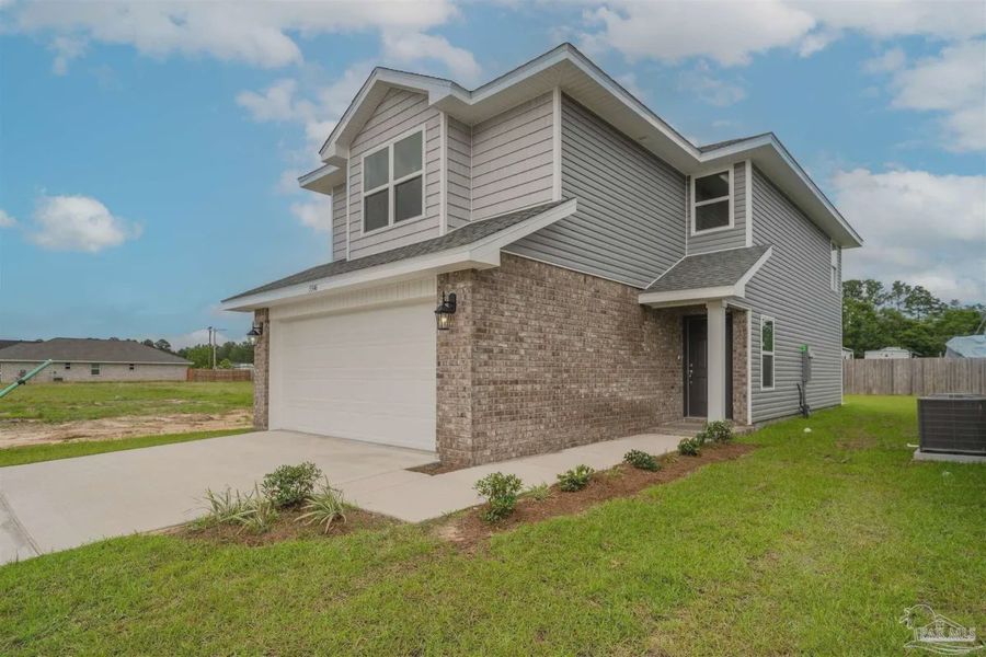 Front exterior of a new home in Westpointe Place, Pensacola, FL, highlighting curb appeal (Image 2).