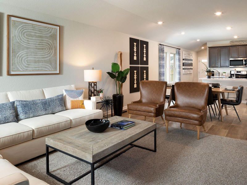 Living area featuring light wood finished floors and recessed lighting