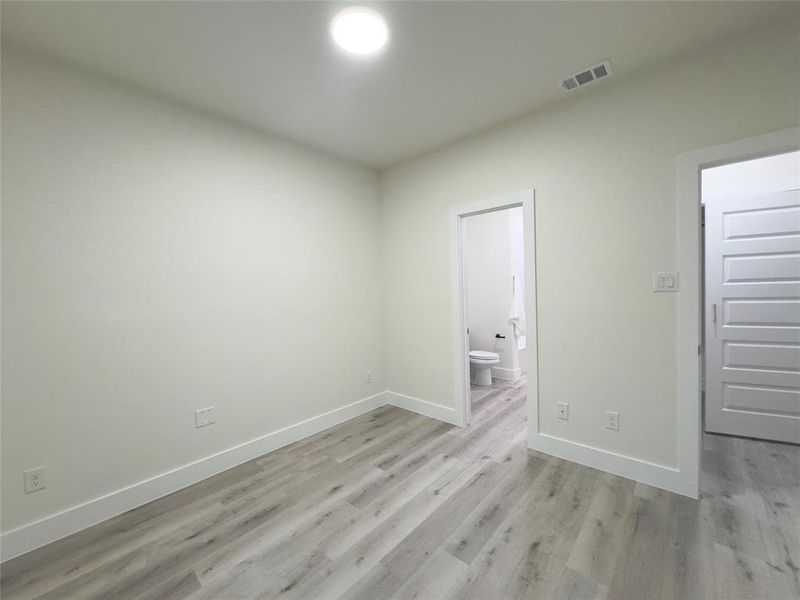 Spare room featuring light wood-type flooring