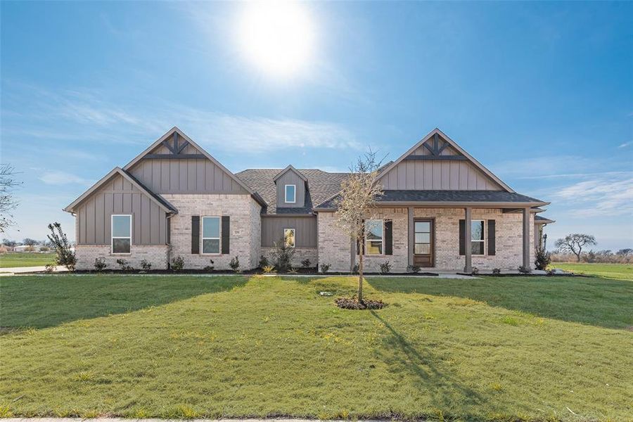 Front exterior of a new home in , Caddo Mills, TX, highlighting curb appeal (Image 23).