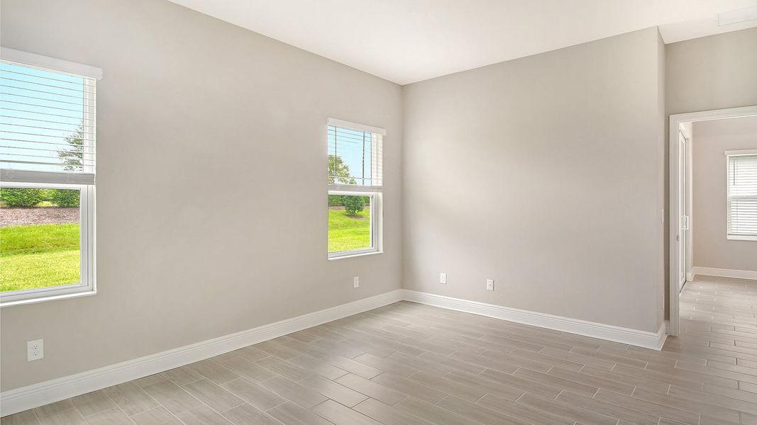 Spacious, unfurnished interior of a new home in Canoe Creek Real Estate and Homes for Sale in Parrish, FL - Neal Communities, Parrish (Image 11).