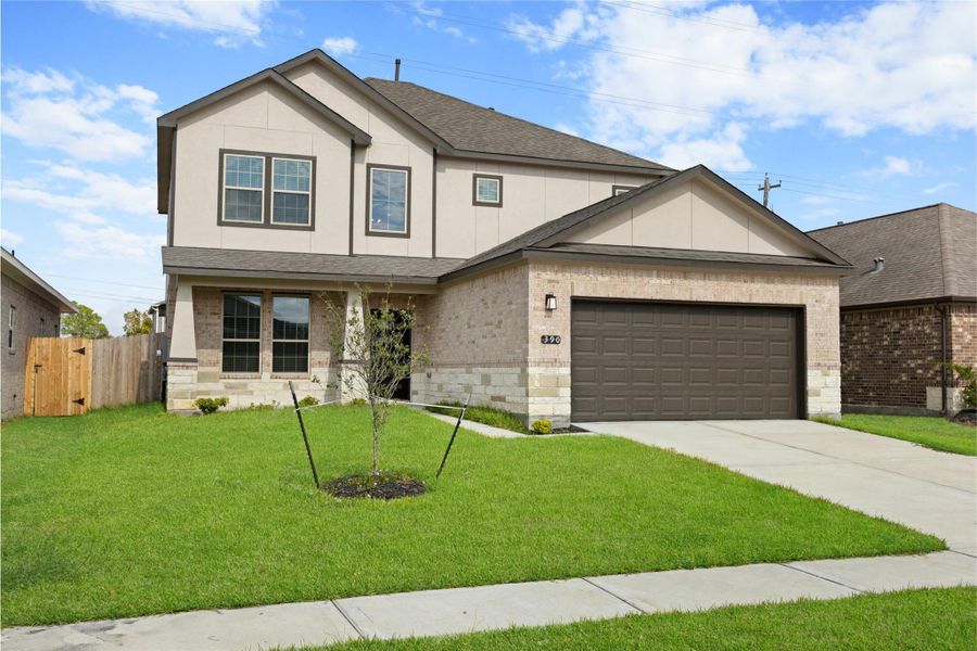 Front exterior of a new home in Kendall Lakes, Alvin, TX, highlighting curb appeal (Image 2). Front exterior of a new home in Kendall Lakes, Alvin, TX, highlighting curb appeal (Image 2).