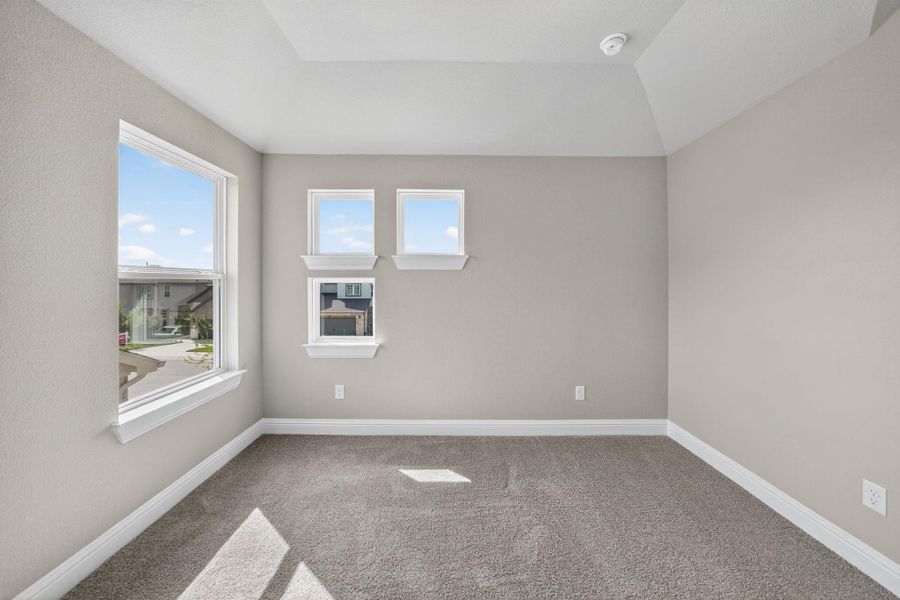Carpeted empty room featuring baseboards Carpeted empty room featuring baseboards