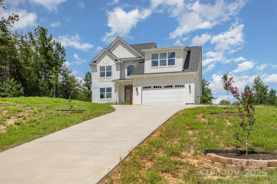 Front exterior of a new home in , Clover, SC, highlighting curb appeal (Image 22). Front exterior of a new home in , Clover, SC, highlighting curb appeal (Image 22).