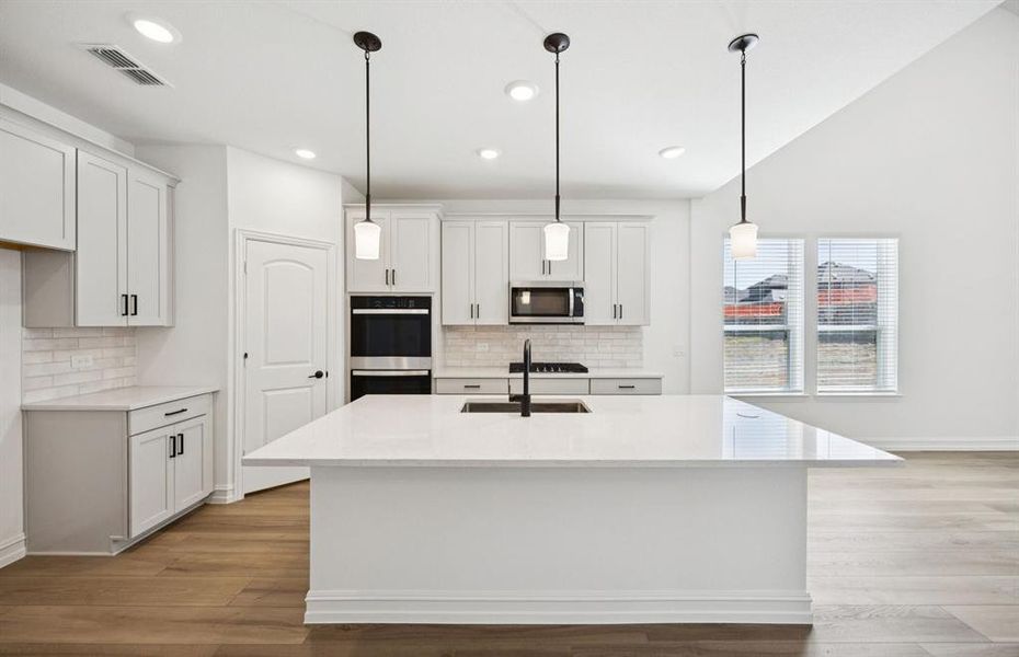 Spacious kitchen with eat-in bartop island