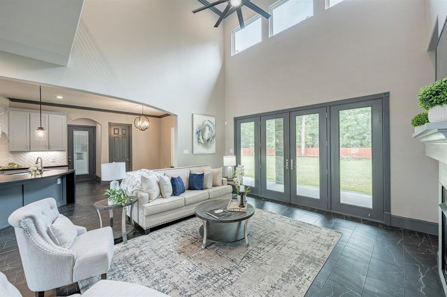 A bright, airy Kitchen Open to the family room with French doors that open into the Patio.