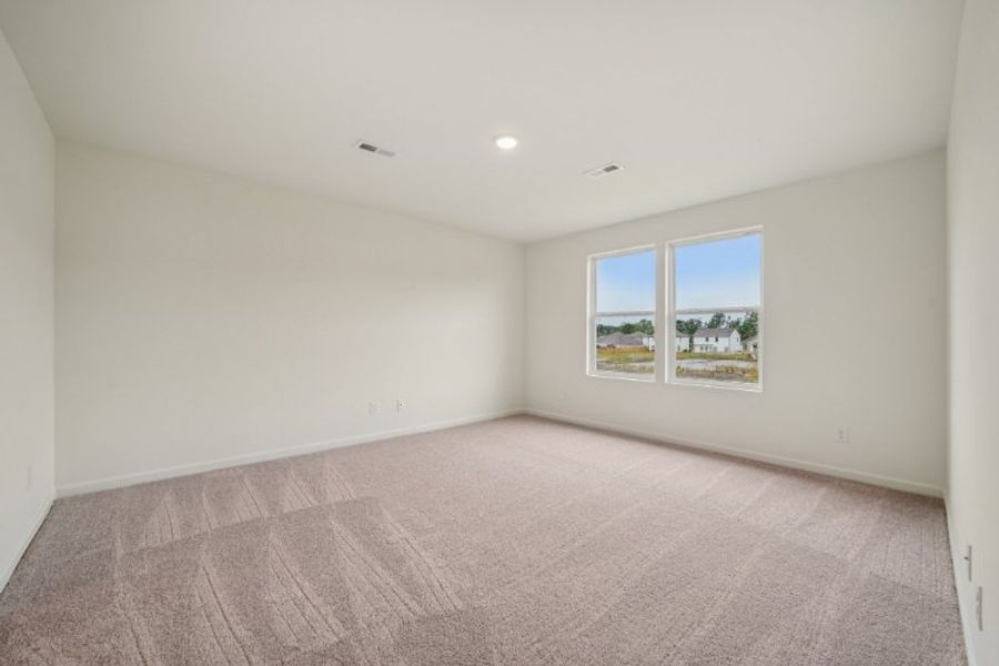 A room with a carpet and a window. A room with a carpet and a window.