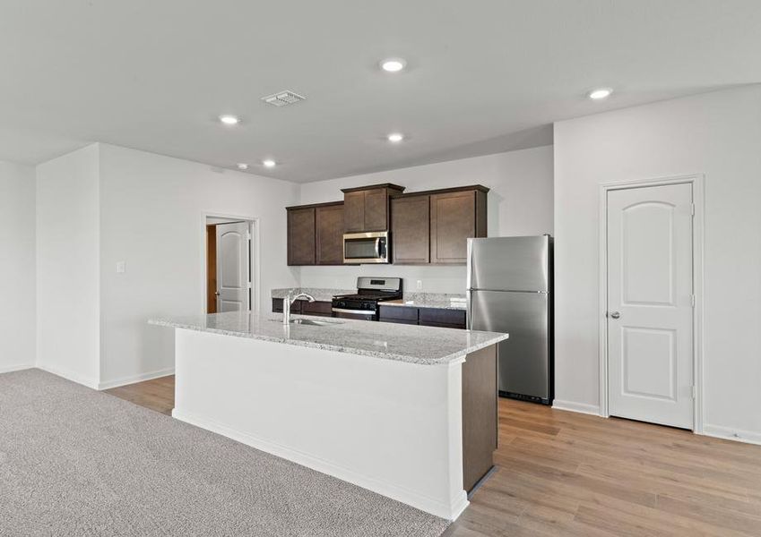 The kitchen has sprawling granite countertops.