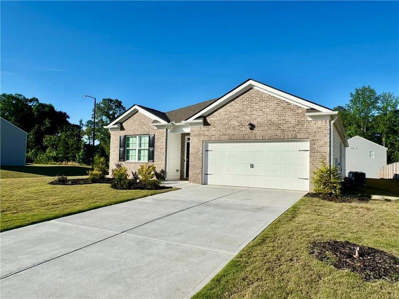 Front exterior of a new home in Oakwood, Dallas, GA, highlighting curb appeal (Image 20).