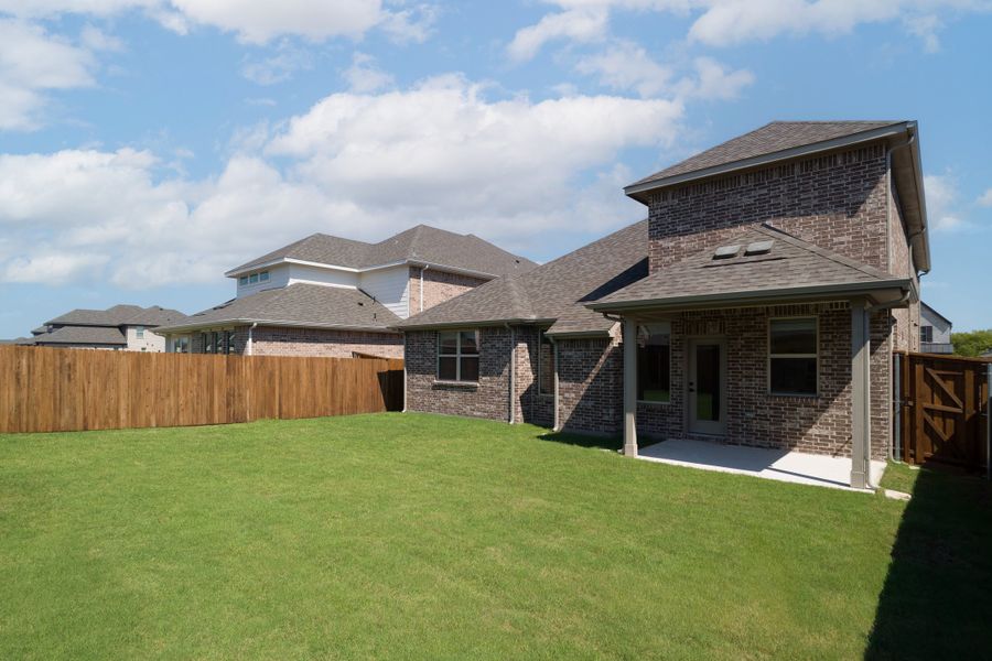 Exterior details and patio area of a home in Valencia on the Lake, Little Elm (Image 2).