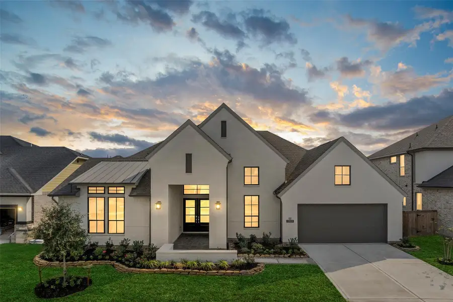 Front exterior of a new home in Bridgeland 70′, Cypress, TX, highlighting curb appeal (Image 1).